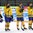 ZUG, SWITZERLAND - APRIL 23: Sweden's Lucas Carlsson #5, Jacob Larsson #7 and Joel Eriksson Ek #28 look on during the national anthem after a 5-2 quarterfinal round loss to Canada at the 2015 IIHF Ice Hockey U18 World Championship. (Photo by Francois Laplante/HHOF-IIHF Images)